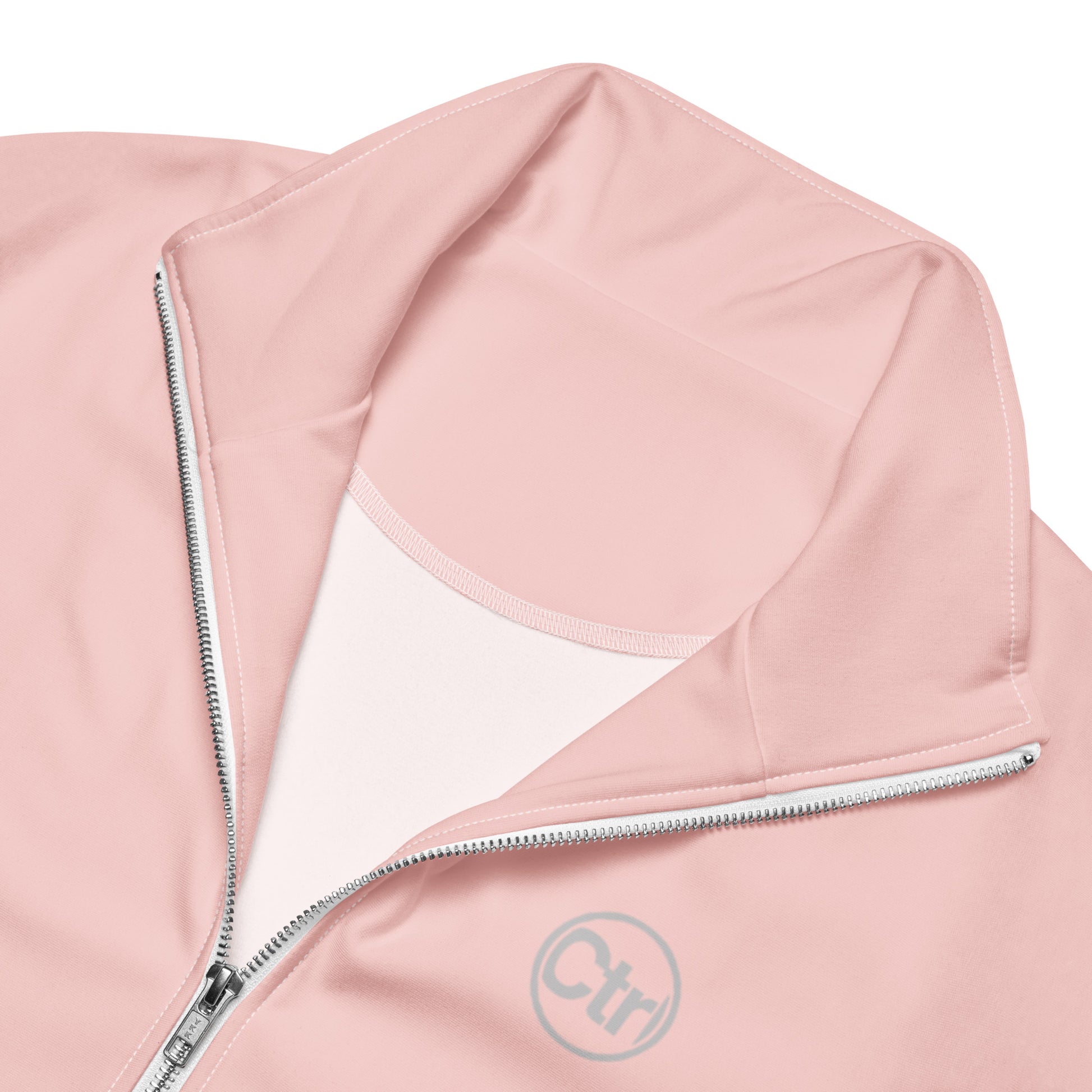 Light pink unisex Ctrl Padel elite track jacket showing zipper and logo 